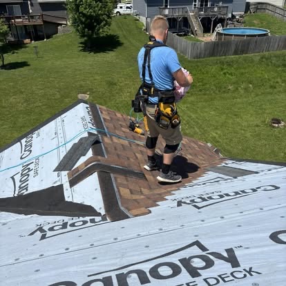 Devin Fleming, owner of Fleming Exterior, on a roofing job